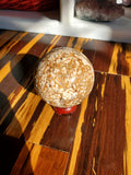 Natural polished Amber Calcite sphere with druzy