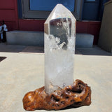 Natural polished Clear Quartz Point on wooden stand