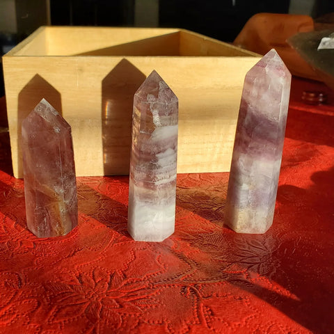 Natural polished Rainbow Fluorite point