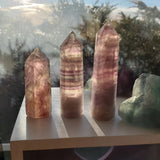 Natural polished Rainbow Fluorite point