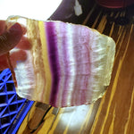 Natural polished Rainbow Fluorite with raw edge
