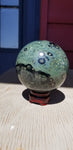 Natural polished Kambaba sphere with stand