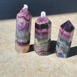 Natural polished Rainbow Fluorite point