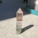 Natural polished Rainbow Fluorite point